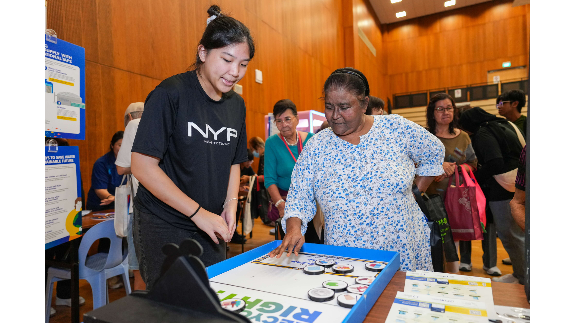 A Teck Ghee resident at one of the sustainability booths