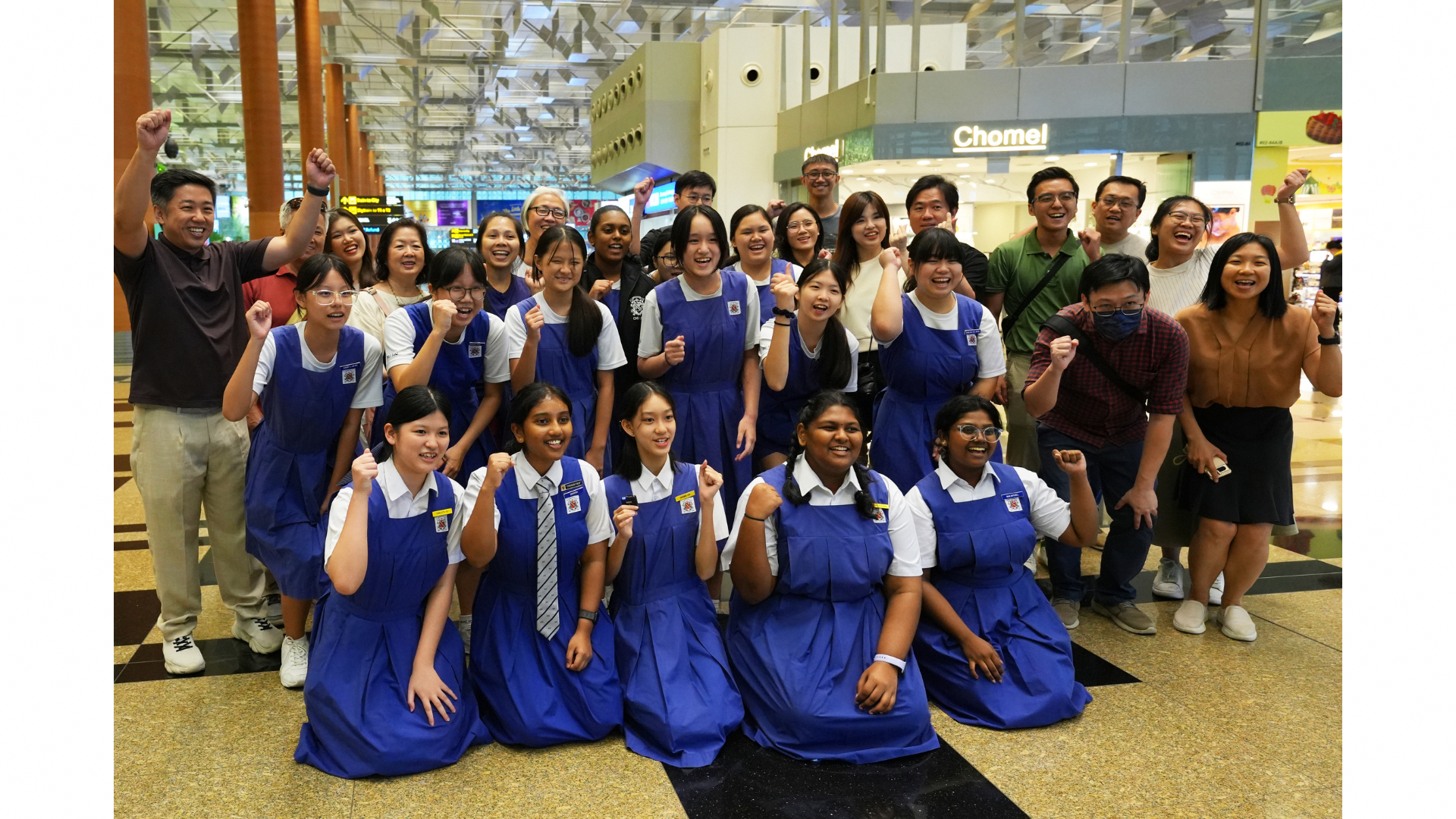 Participants of the sustainability trail smiling for a group picture at Changi Airport