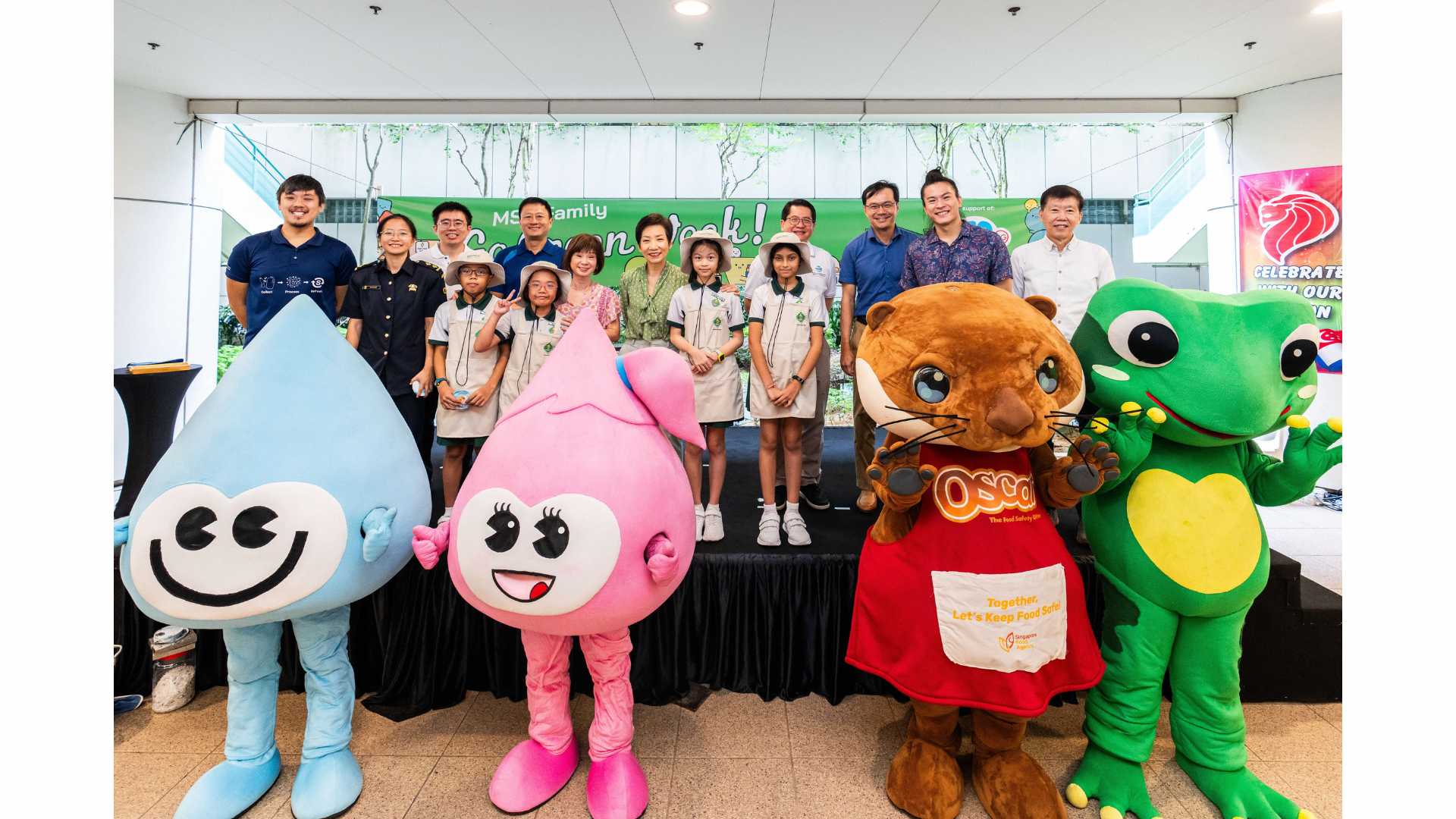 A group photo with Minister Grace Fu, SMS Dr Amy Khor, partners and mascots of NEA, PUB, SFA