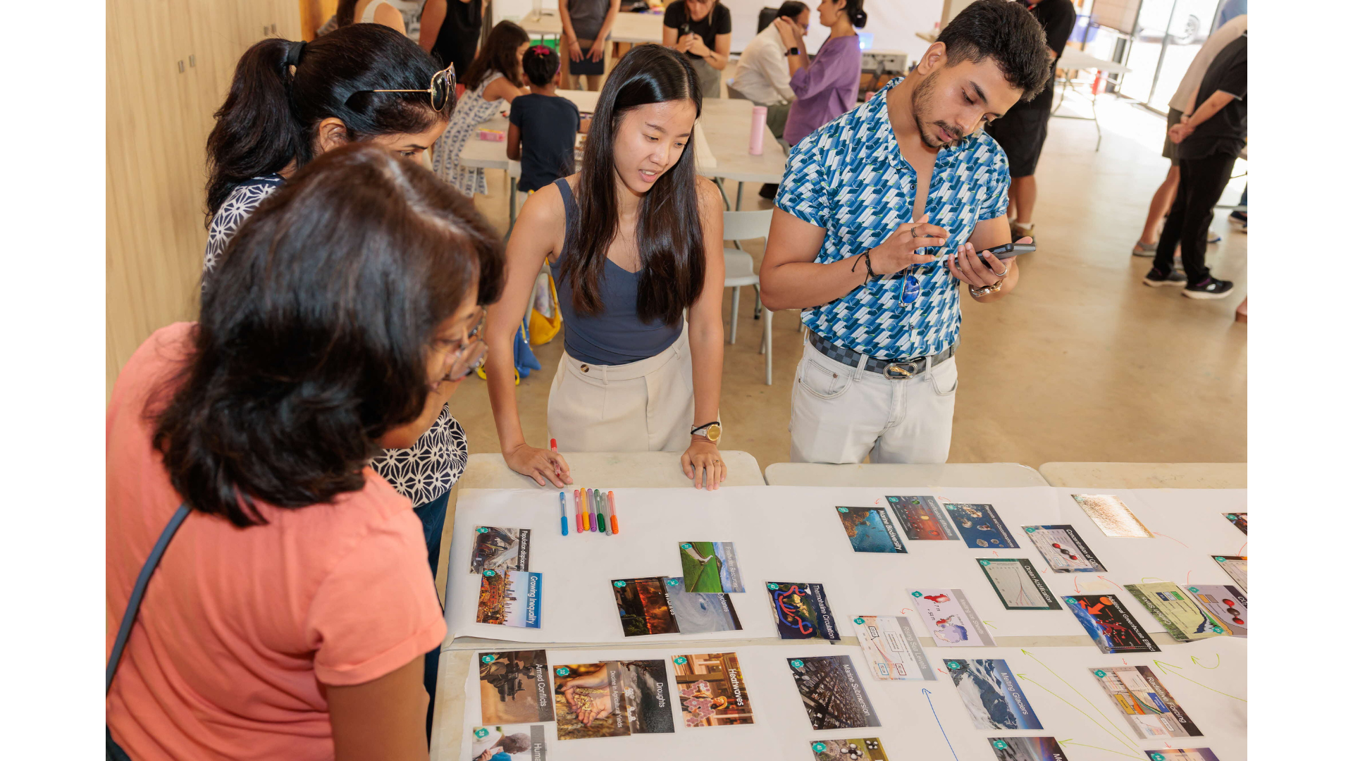 Participants reading cards on table