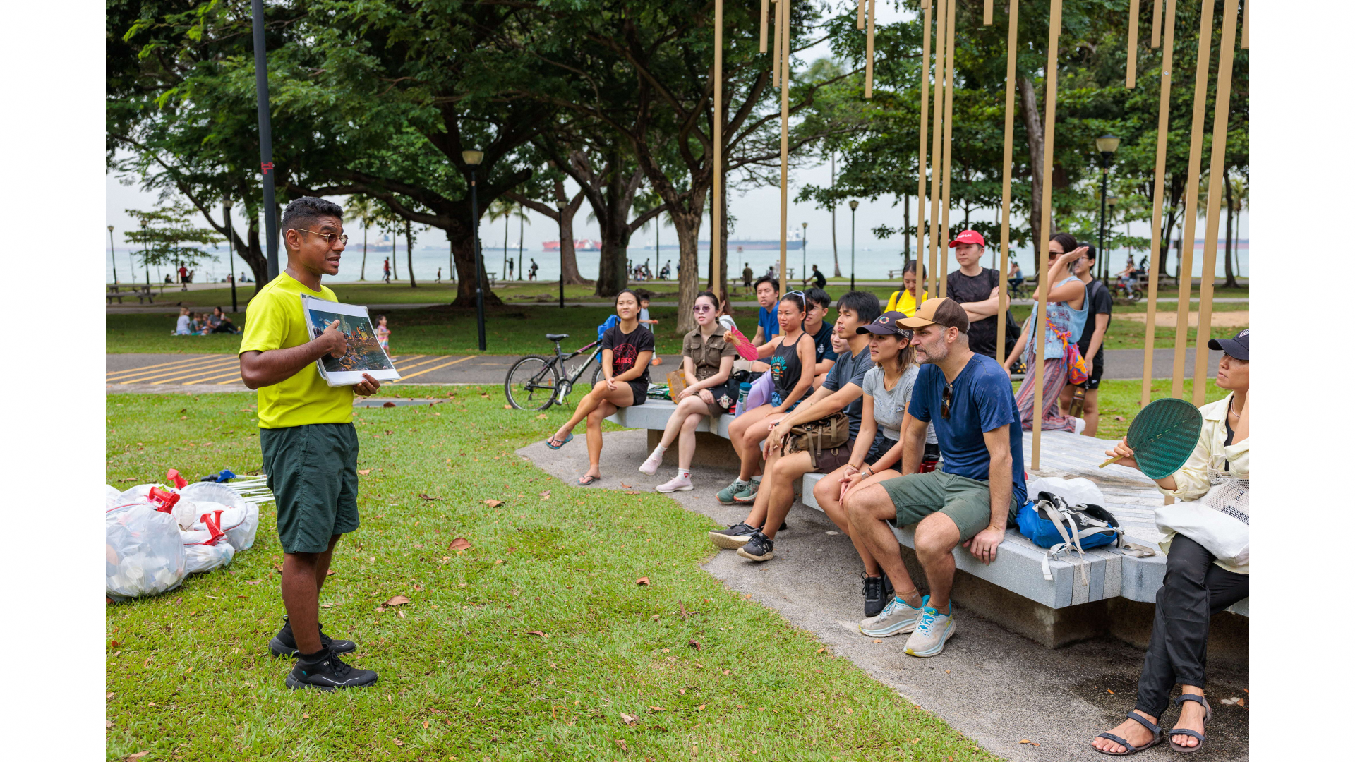 Yasser (left) advising the ways to tackle litter