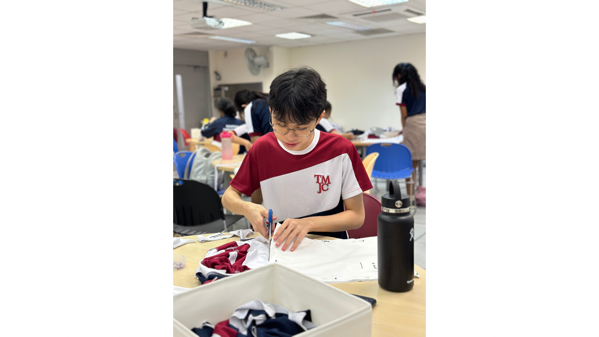 A TMJC student repurposing a pre-loved uniform